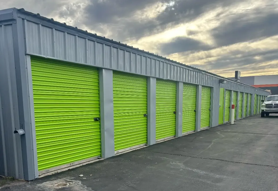 Exterior of outdoor green storage units at Mountain Vista North Mini Storage.