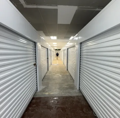Inside hallway of Ken's Korner Mini Storage with units on each side