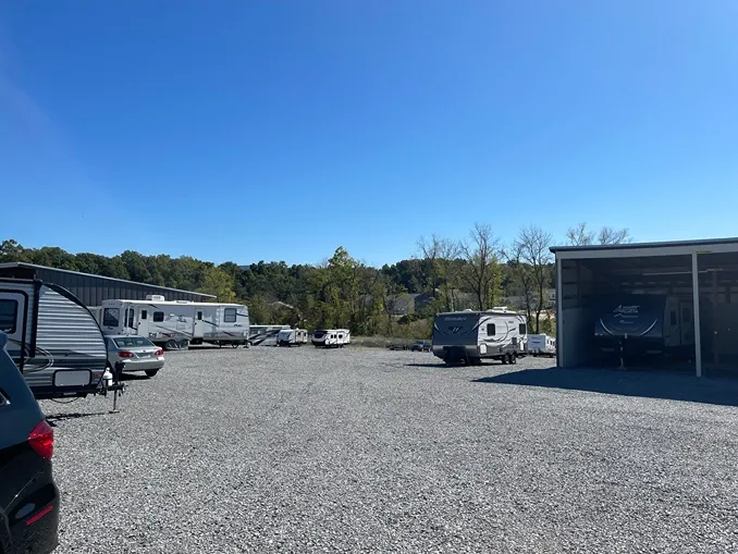 View of uncovered and covered vehicle storage at Volunteer Storage Maryville 2 facility.