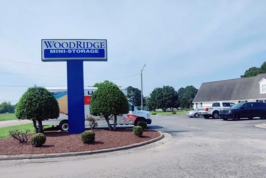 Woodridge Mini Storage monument sign with U-Haul in the background