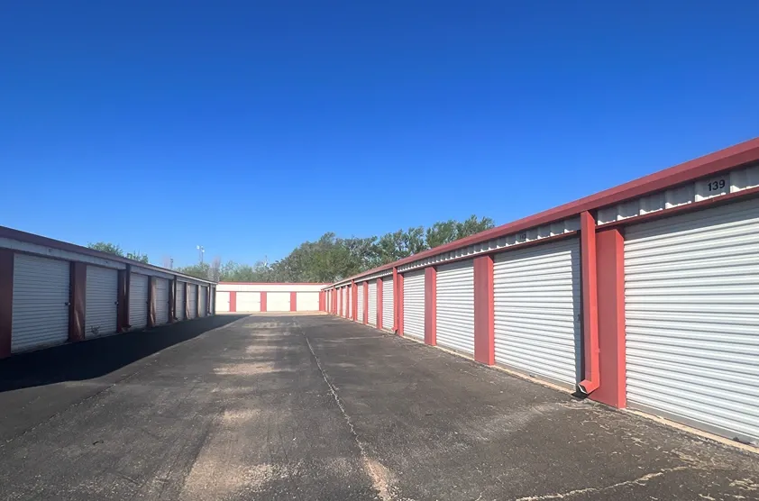 Exterior of outdoor storage at MRC Self Storage facility with paved roads.
