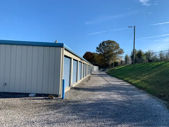 Close-up of unit doors with gravel access at Volunteer Storage Seymour.