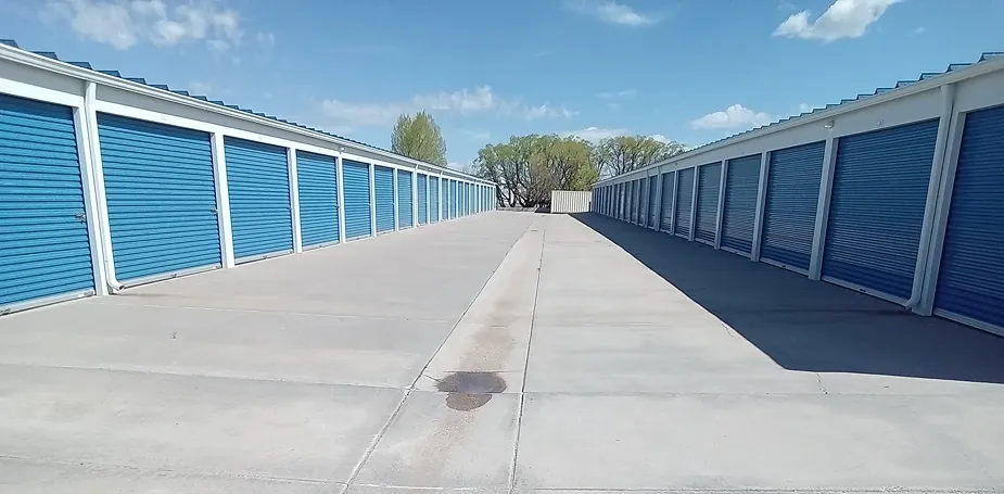 Drive-up storage units with paved access lanes at Speedway Storage.