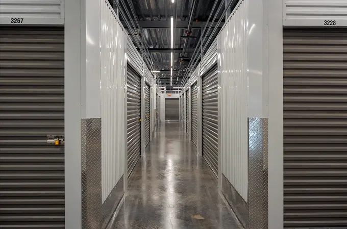 Modern interior with storage access and camera surveillance at Storage Lounge.