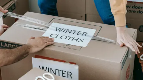 Storage box with winter clothes sign.