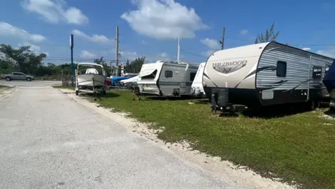 Outdoor vehicle storage with RVs at Big Pine Storage.