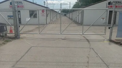 View of gate at Federal Storage facility.