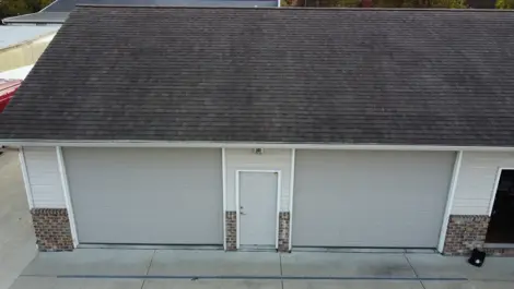 Multiple metal storage units with gravel access paths at Lambertville Mini Storage Secor.