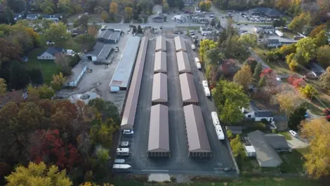 View of fenced perimeter and gravel driveway at Lambertville Mini Storage Secor.