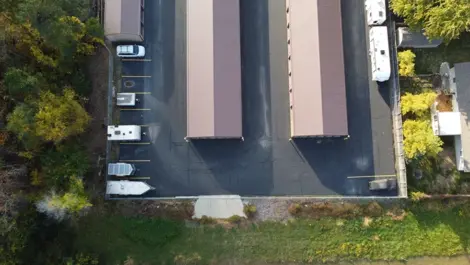 Straight View down a row of metal roll-up storage units at Lambertville Mini Storage Secor.