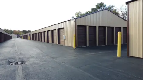 Open parking area and fence at Lambertville Mini Storage Secor.