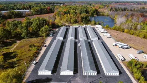 Storage unit row with metal doors and wide access at Osprey Storage Shaver.