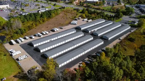 Straight drive lane with storage units on both sides at Osprey Storage Shaver.