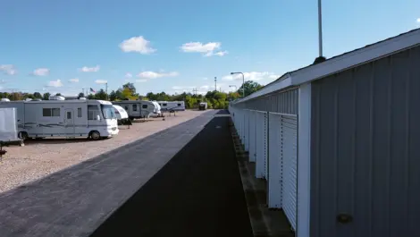 Open gravel area and roll-up units at Osprey Storage Shaver.