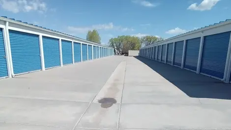 Drive-up storage units with paved access lanes at Speedway Storage.