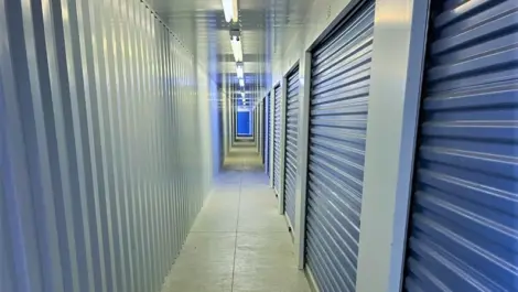 Wide driveways and roll-up doors at Speedway Storage facility.