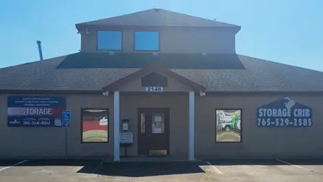 Open lot with unit access and secure fencing at Storage Crib.
