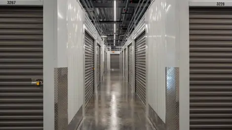 Modern interior with storage access and camera surveillance at Storage Lounge.