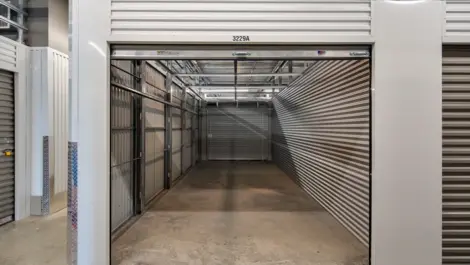Hallway View with bright lighting and clean storage unit access at Storage Lounge.