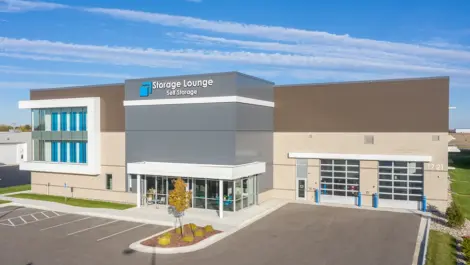 Storage Lounge exterior with secure fencing and nearby street parking.