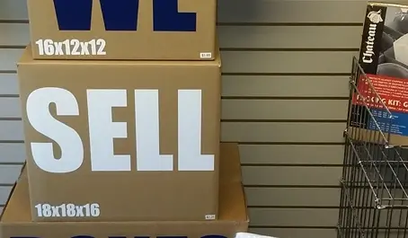 Packing supplies display with boxes and tape at Storage Crib.