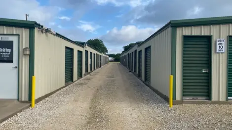 Exterior View of Trio Self Storage with roll-up doors and fenced perimeter.
