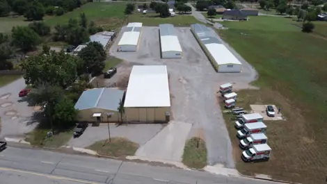 Front View of Vernon Self Storage with facility signage and fenced entry.