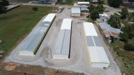 Wide drive aisle between storage unit buildings at Vernon Self Storage.