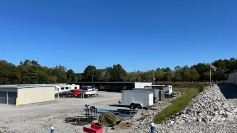 Storage unit buildings with gravel driveways at Volunteer Storage Vonore.