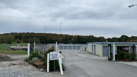 Storage unit row and gravel access path at Volunteer Storage Vonore.