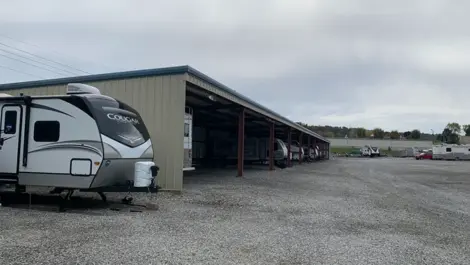 Facility exterior with vehicle parking and open unit access at Volunteer Storage Vonore.