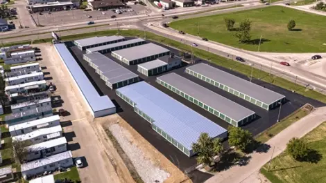 Front View of Wagner Ford Self Storage with gated entry and building signage.