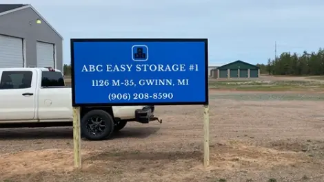 ABC Easy Storage 1 signage in front of maintenance truck and building