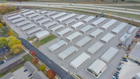 Exterior storage units with metal doors and clear access path at Osprey Storage Howard.