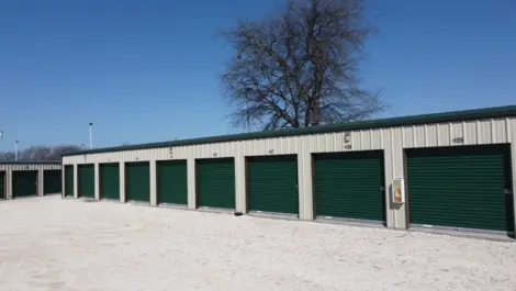 Exterior View of Trio Self Storage with roll-up doors and fenced perimeter.