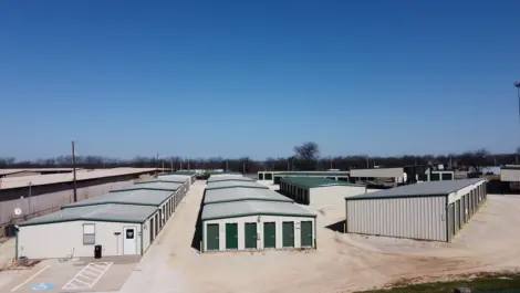 Wide driveways and rows of storage units at Trio Self Storage.