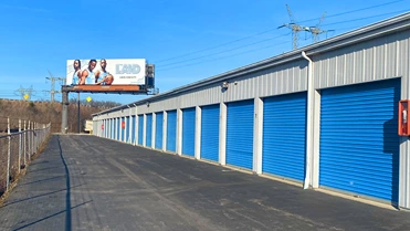 Outside units at French Creek Self Storage near fence line.