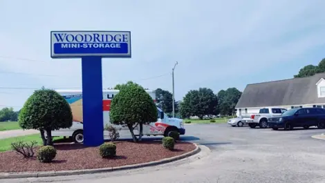 Woodridge Mini Storage monument sign with U-Haul in the background