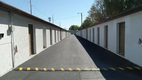 Units on both sides of wide aisle at Federal Storage featuring speed bump